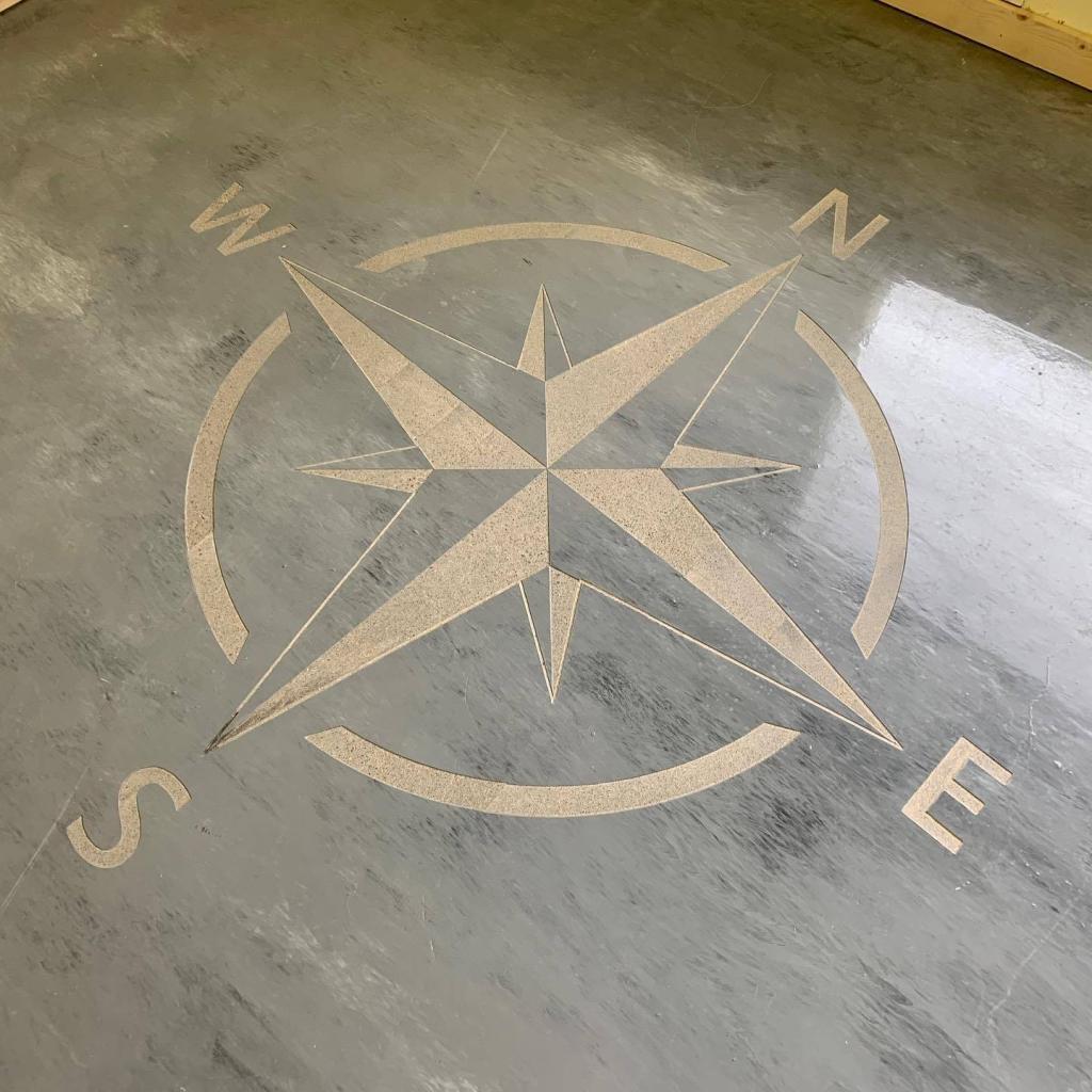 Engraved floral design on sidewalk